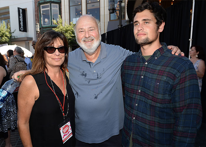 Rob Reiner's son with two people at an outdoor event, capturing a moment that involves celebrities and a party setting. Rob Reiner's son with two people at an outdoor event, capturing a moment that involves celebrities and a party setting.