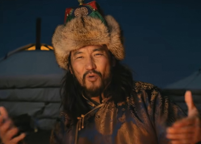 Mongolian man in traditional attire performing throat singing outdoors at night for the viral Christmas anthem of 2025. Mongolian man in traditional attire performing throat singing outdoors at night for the viral Christmas anthem of 2025.