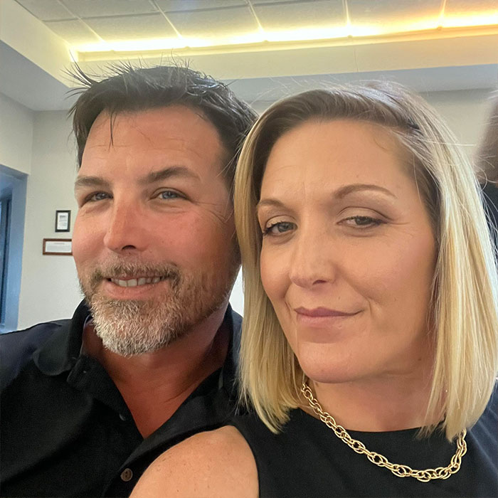 Man and woman posing for a close-up selfie, related to a heated NFL argument with family and chilling final call to sister.