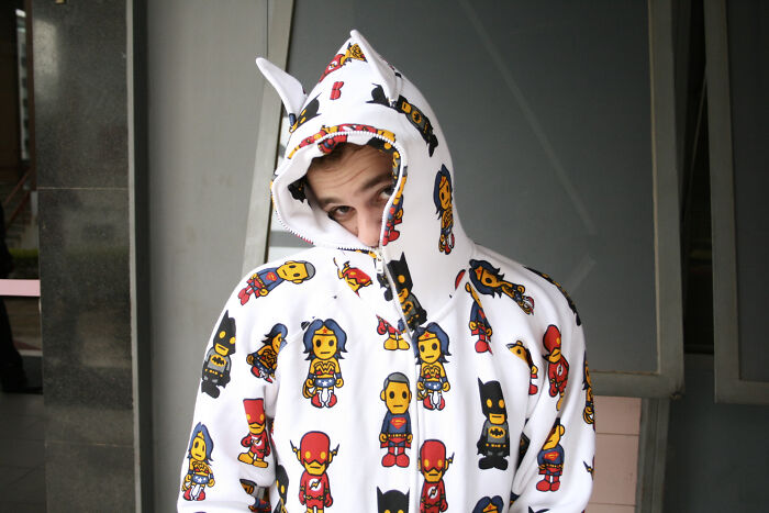 Young person wearing a colorful superhero hoodie, showcasing one of the 68 true stories that sound completely made up.