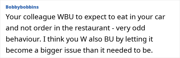 Woman standing confidently at work, ignoring social pressure from coworkers despite potential awkwardness.