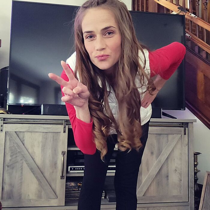 Woman making a peace sign indoors, related to racist Cinnabon employee and GoFundMe linked to viral video incident. Woman making a peace sign indoors, related to racist Cinnabon employee and GoFundMe linked to viral video incident.