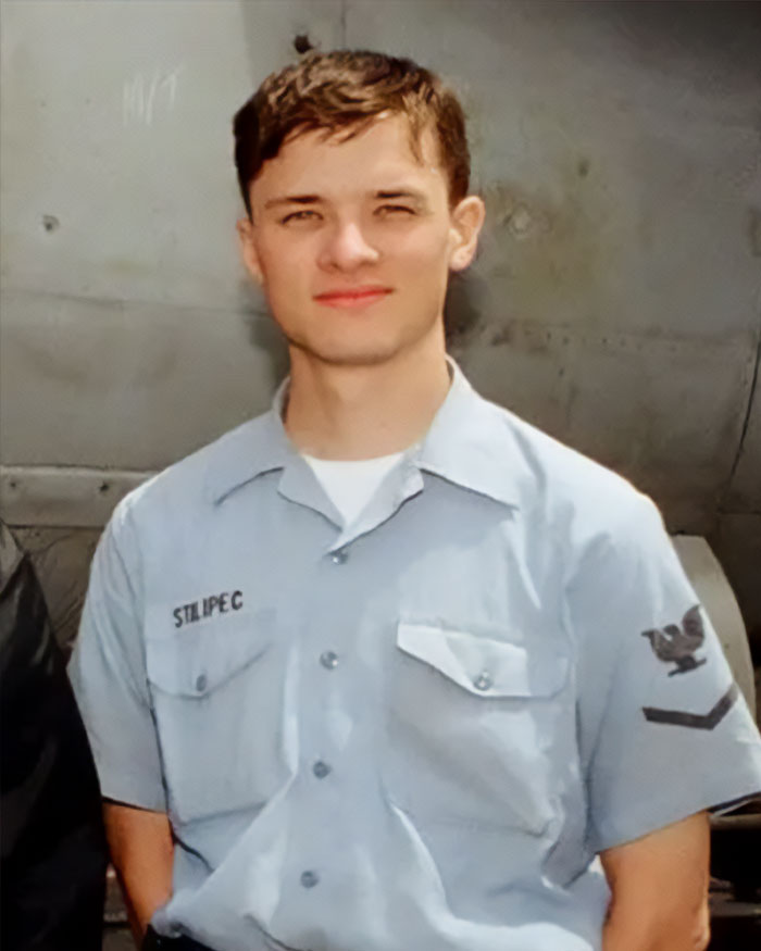 High school teacher in costume photos causing outrage among parents, wearing a blue uniform shirt standing indoors. High school teacher in costume photos causing outrage among parents, wearing a blue uniform shirt standing indoors.