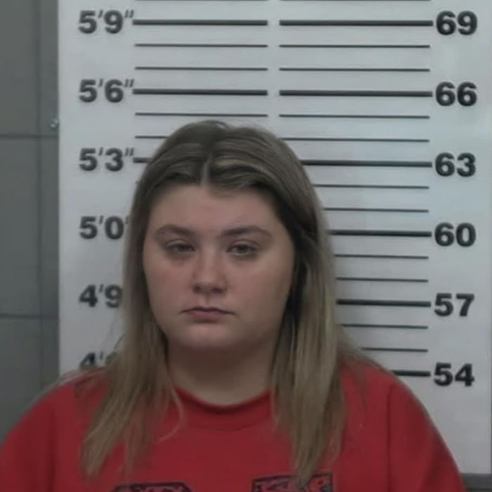 Mugshot of beauty queen accused in toddler’s passing case, appearing in court with a different look than before.