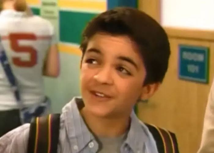 Young Nickelodeon star Tylor Chase smiling in a school hallway, with a backpack over his shoulder. Young Nickelodeon star Tylor Chase smiling in a school hallway, with a backpack over his shoulder.