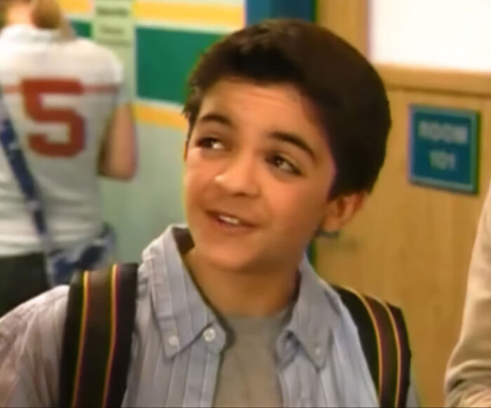 Young Nickelodeon star smiling in a school hallway, highlighting struggle with homelessness in a recent video. Young Nickelodeon star smiling in a school hallway, highlighting struggle with homelessness in a recent video.