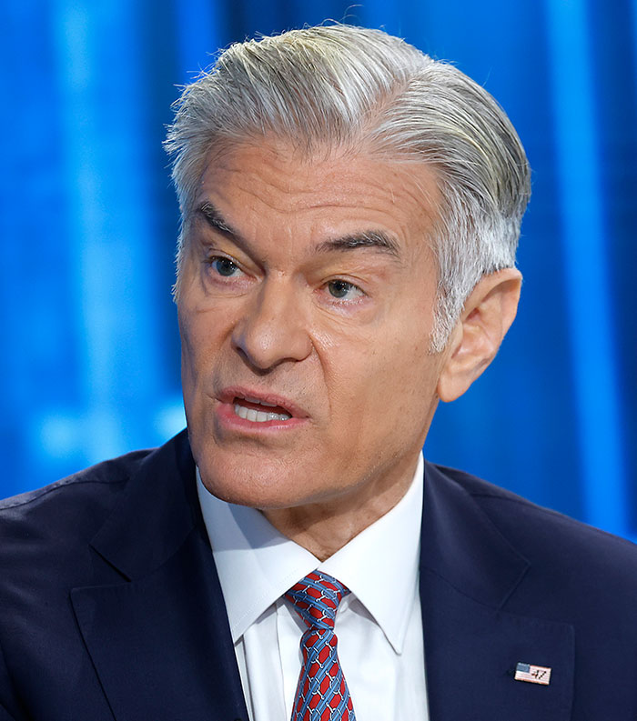 Older man with gray hair in a dark suit and patterned tie speaking in a studio about most disliked celebrities 2025.