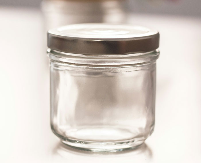 Clear glass jar with metal lid, a quirky white elephant gift perfect for fun and unique gift exchanges.