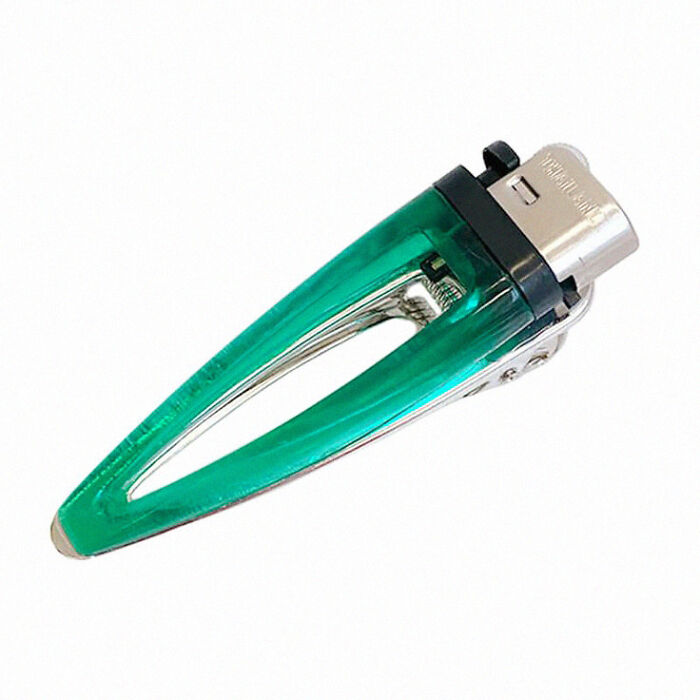 Trippy picture of a green hair clip with metallic clasp isolated on white background, appearing surreal and unusual.