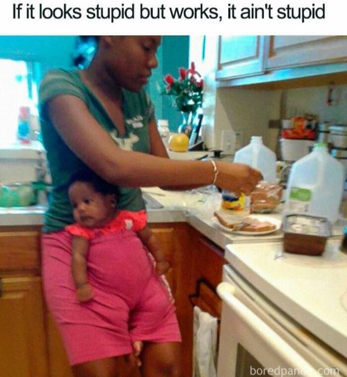 Parent multitasking in kitchen carrying baby in pants while preparing food, showing relatable parenting moments meme.