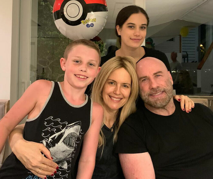 Riley Keough with family smiling indoors, highlighting court docs revealing biological mother link to John Travolta’s son Ben. Riley Keough with family smiling indoors, highlighting court docs revealing biological mother link to John Travolta’s son Ben.