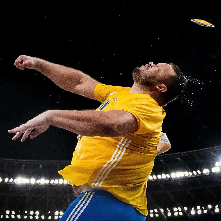 Athlete in yellow jersey captured mid-action at stadium, showcasing unforgettable 2025 pop culture moments in sports.