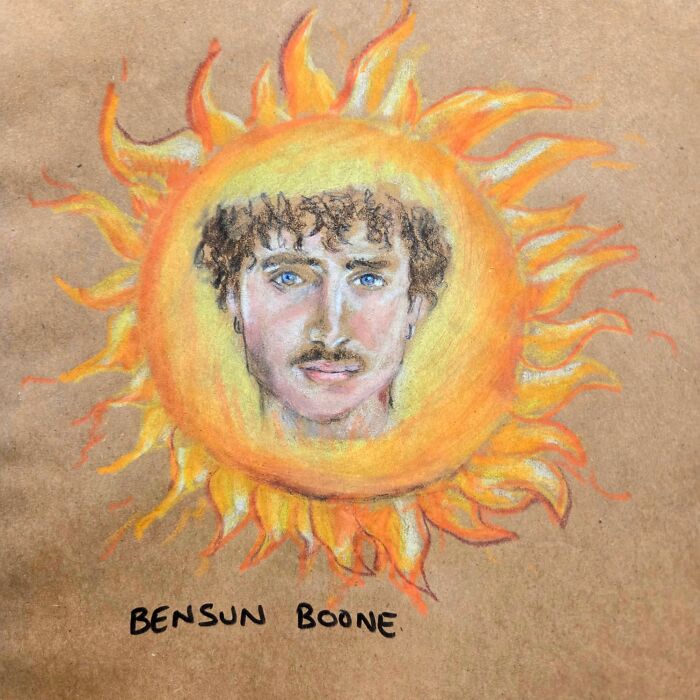 Hand-drawn colorful sun with a man’s face in the center on a brown paper lunch bag, dad jokes and puns artwork.
