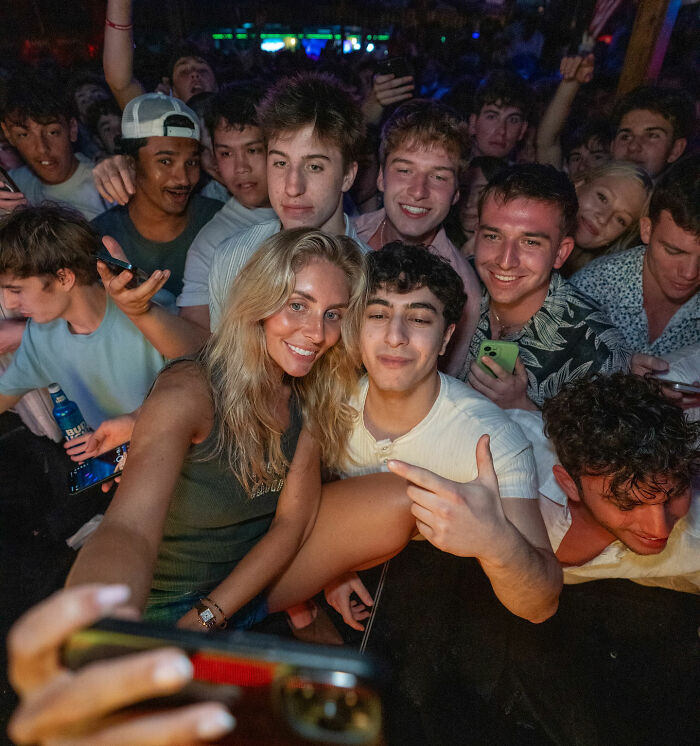 Group of young people at a party taking a selfie, capturing a moment after Bonnie Blue learns her fate following controversial arrest Group of young people at a party taking a selfie, capturing a moment after Bonnie Blue learns her fate following controversial arrest