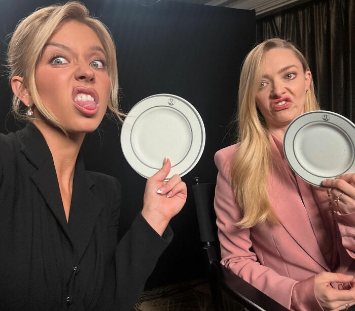 Two women making funny faces holding white plates, related to Sydney Sweeney lie detector test controversy. Two women making funny faces holding white plates, related to Sydney Sweeney lie detector test controversy.