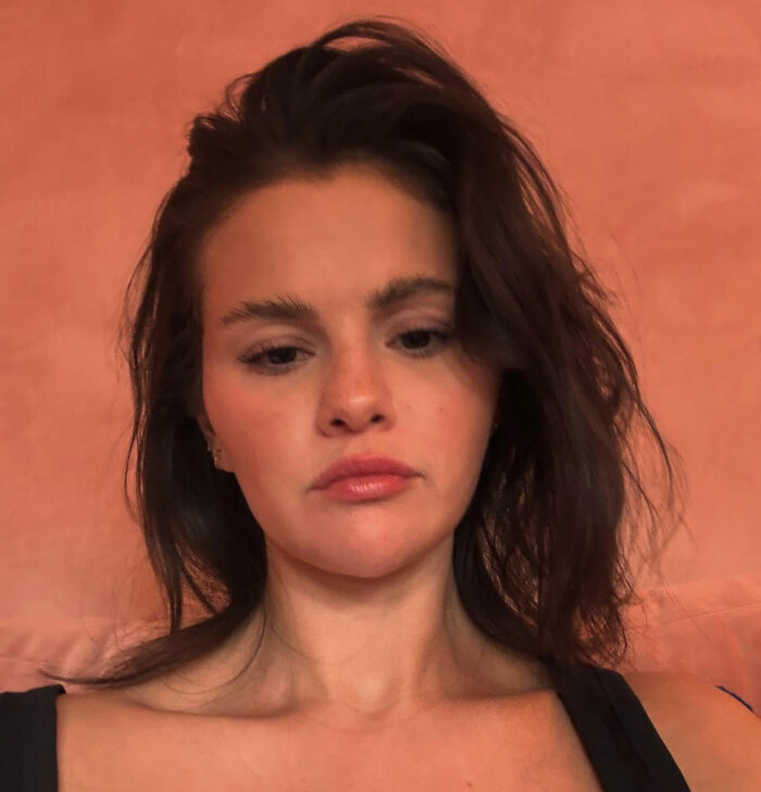 Selena Gomez with tousled hair and natural makeup, sharing her response about how she shaves her mustache. Selena Gomez with tousled hair and natural makeup, sharing her response about how she shaves her mustache.