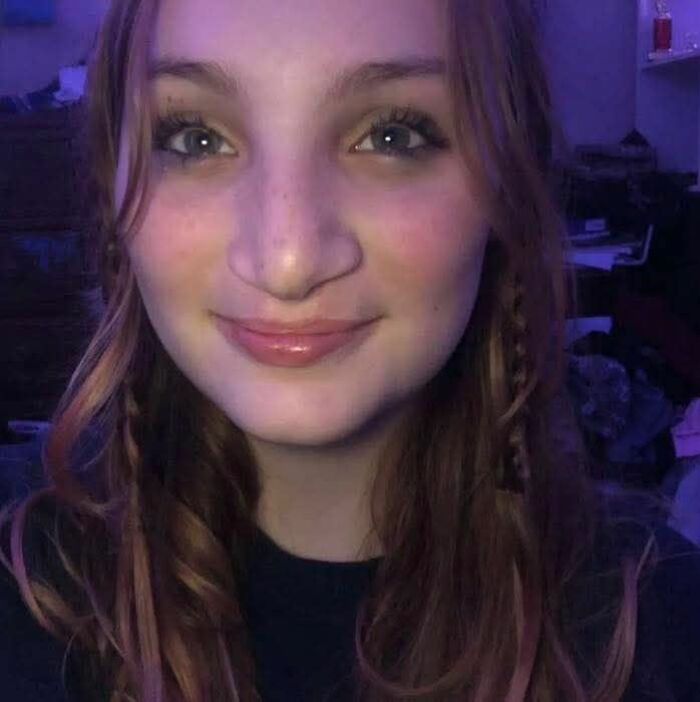 Young woman with long hair smiling softly, highlighting the disturbing tactic accused teens used to lure daughter into woods before attack. Young woman with long hair smiling softly, highlighting the disturbing tactic accused teens used to lure daughter into woods before attack.