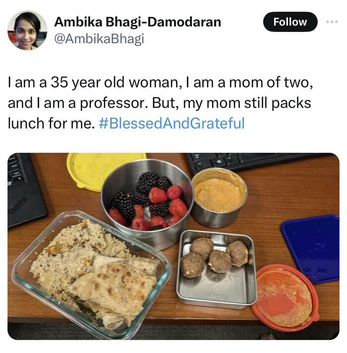 Tweet about a woman’s mom packing lunch, with food containers on a desk, cheerful memes about wasting time online.