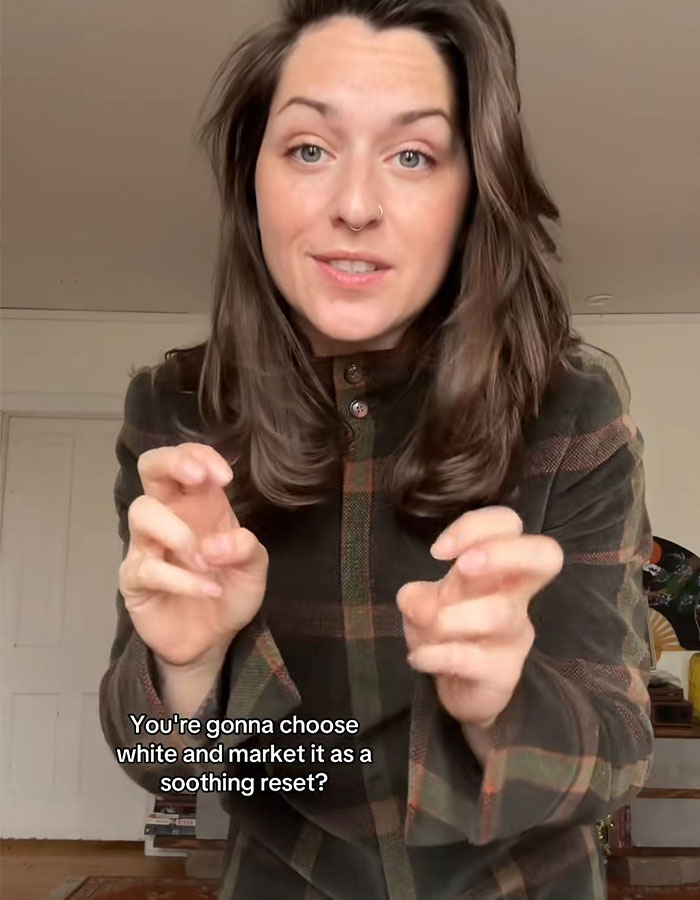 Woman in a plaid shirt speaking about Pantone’s controversial Color of the Year sparking an online meltdown.