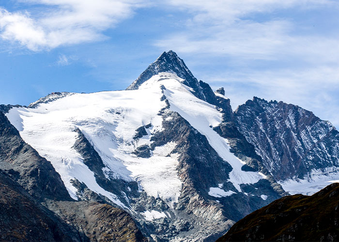 Snow-covered Austrian mountain peak under a blue sky, related to boyfriend who abandoned woman on Austrian mountain story. Snow-covered Austrian mountain peak under a blue sky, related to boyfriend who abandoned woman on Austrian mountain story.