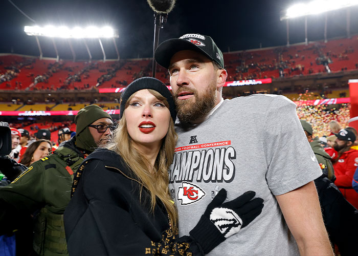Taylor Swift with a man wearing a Chiefs champions shirt at a crowded football stadium after a game celebration Taylor Swift with a man wearing a Chiefs champions shirt at a crowded football stadium after a game celebration