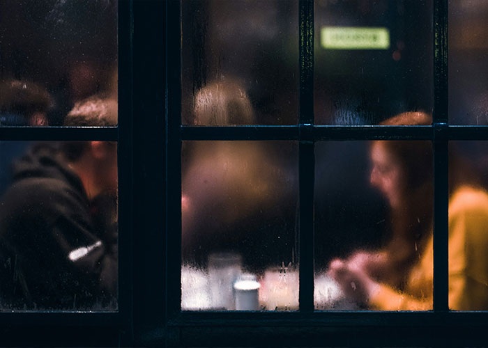 People having intimate encounters and K-drama-style dates seen through a foggy window at night. People having intimate encounters and K-drama-style dates seen through a foggy window at night.