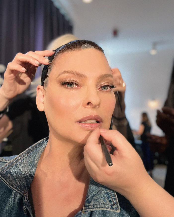 Linda Evangelista having makeup applied during Coolsculpting photoshoot, highlighting beauty and transformation process. Linda Evangelista having makeup applied during Coolsculpting photoshoot, highlighting beauty and transformation process.