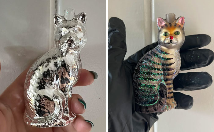 Silver and painted cat figurines held in hands, showcasing personalized thrifted art with funny and unexpected additions.