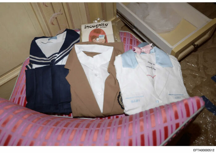 Role-play costumes laid out on a bed exposing troubling art from the Epstein file dump in a NYC townhouse setting. Role-play costumes laid out on a bed exposing troubling art from the Epstein file dump in a NYC townhouse setting.