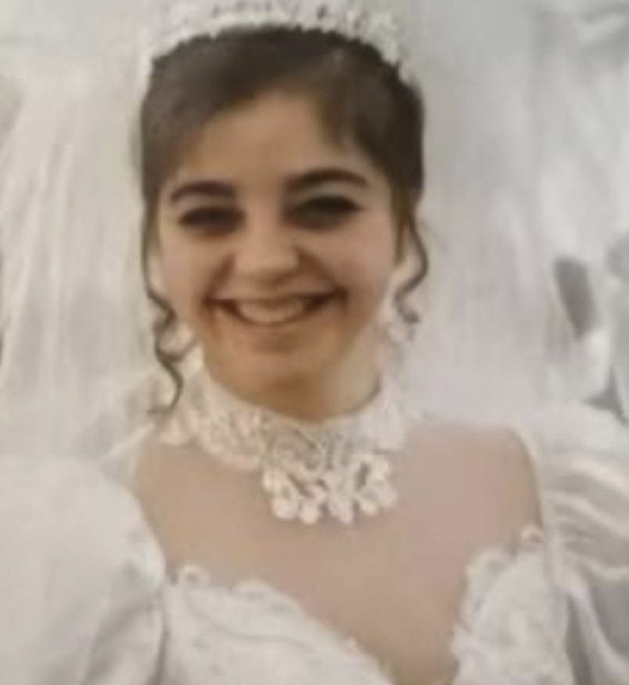 Young woman in a white lace dress smiling, related to George Clooney shares heartfelt tribute after sister passes away Young woman in a white lace dress smiling, related to George Clooney shares heartfelt tribute after sister passes away