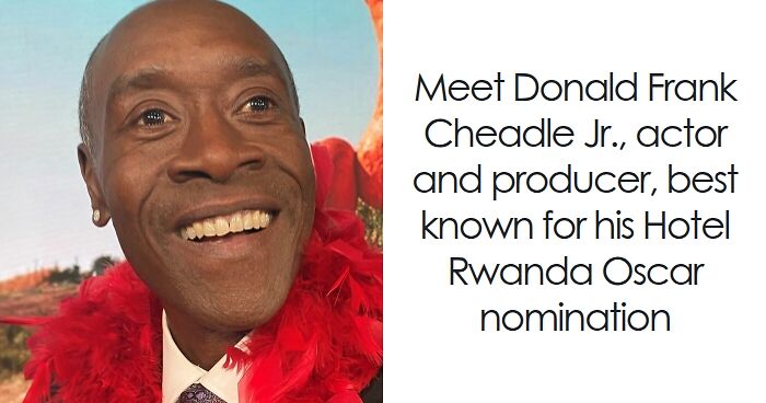 Don Cheadle smiling warmly, wearing a red feather boa, highlighting his bio and career achievements.