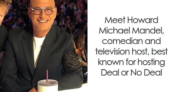 Howie Mandel smiling at an event wearing glasses and a black jacket, representing his bio and career highlights.