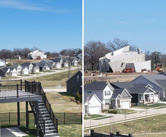 A neighborhood with conventional houses and one large evil building under construction resembling a horror movie set.