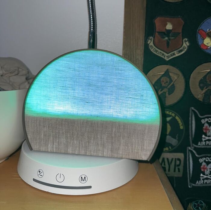 Round LED light therapy lamp on a wooden surface, one of the popular products on Amazon wish lists.