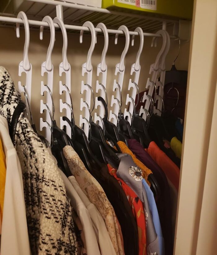 A Set Of Space Saving Hangers Will Convince Your Overstuffed Closet That It's Actually A Magical, Tardis-Like Space That Can Hold Way More Than You Ever Thought Possible