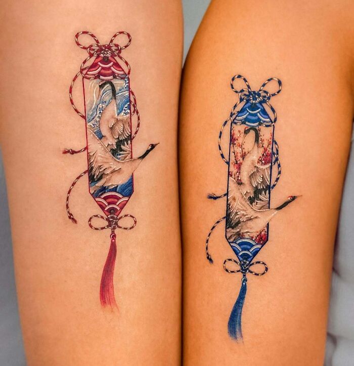Matching colorful crane tattoos with intricate designs and ribbon details, showcasing wholesome tattoos with meaningful ink. Matching colorful crane tattoos with intricate designs and ribbon details, showcasing wholesome tattoos with meaningful ink.
