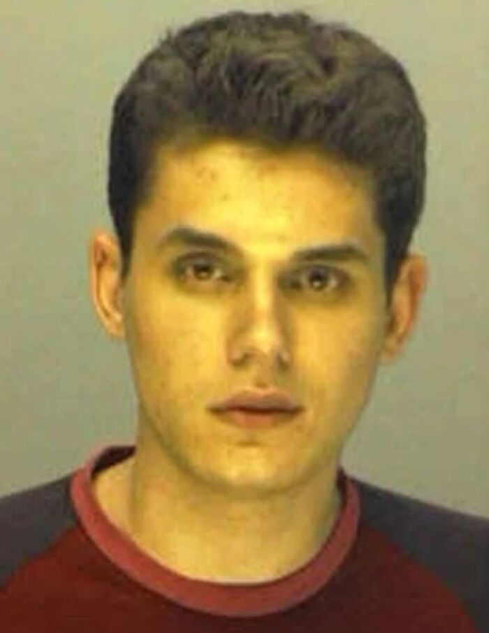 Young man in a famous celebrity mugshot, taken during an arrest related to a high-profile incident.