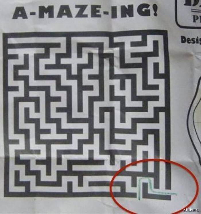 A printed maze puzzle with a highlighted impossible path, illustrating pointless things that serve no purpose.
