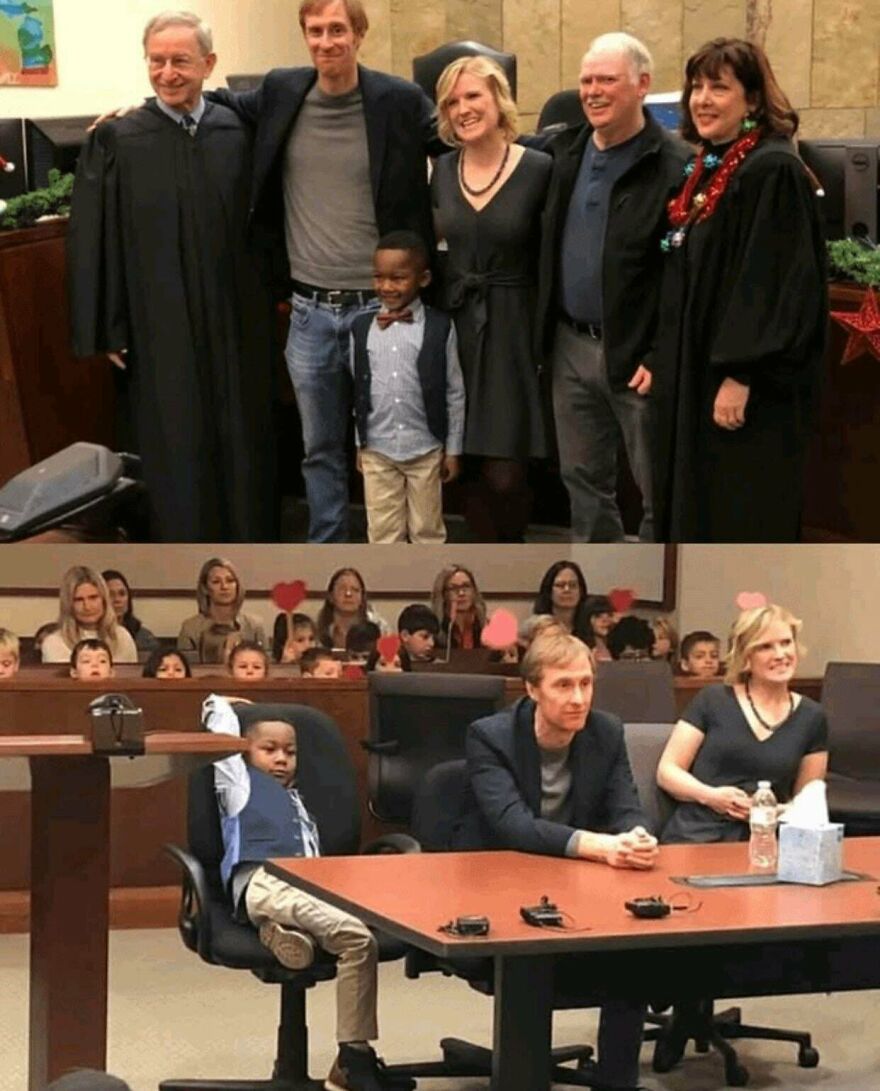 Group photo with a boy, adults, and judges in a courtroom, one boy sitting relaxed at a table, a random picture worth going down a rabbit hole for