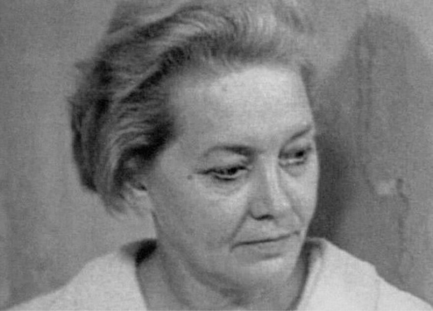 Black and white portrait of a woman with short hair looking down, one of the random pictures worth going down a rabbit hole for.