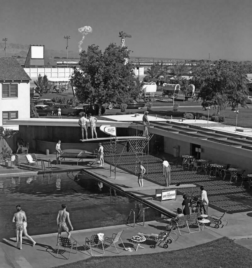 Black and white vintage photo of people by a pool with dive boards, showcasing random pictures worth going down a rabbit hole for.