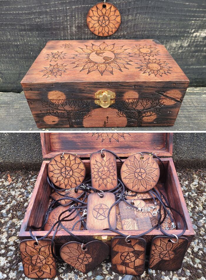 Wooden box and carved pendants with sun and tree designs symbolizing leap of faith and best life decisions.
