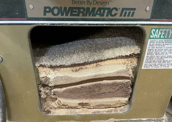 Close-up of a woodworking machine cutting intricate layers of wood, showcasing different jobs that make a 9-to-5 bearable.