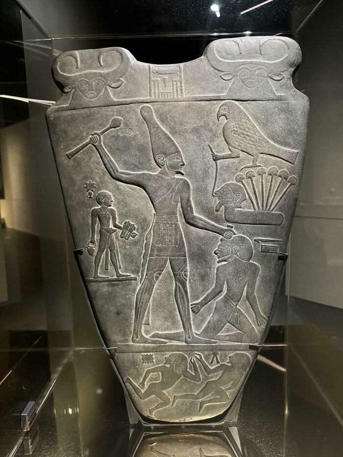 Ancient Egyptian stone relief depicting figures and hieroglyphs, an incredible photograph from ancient Egypt history.