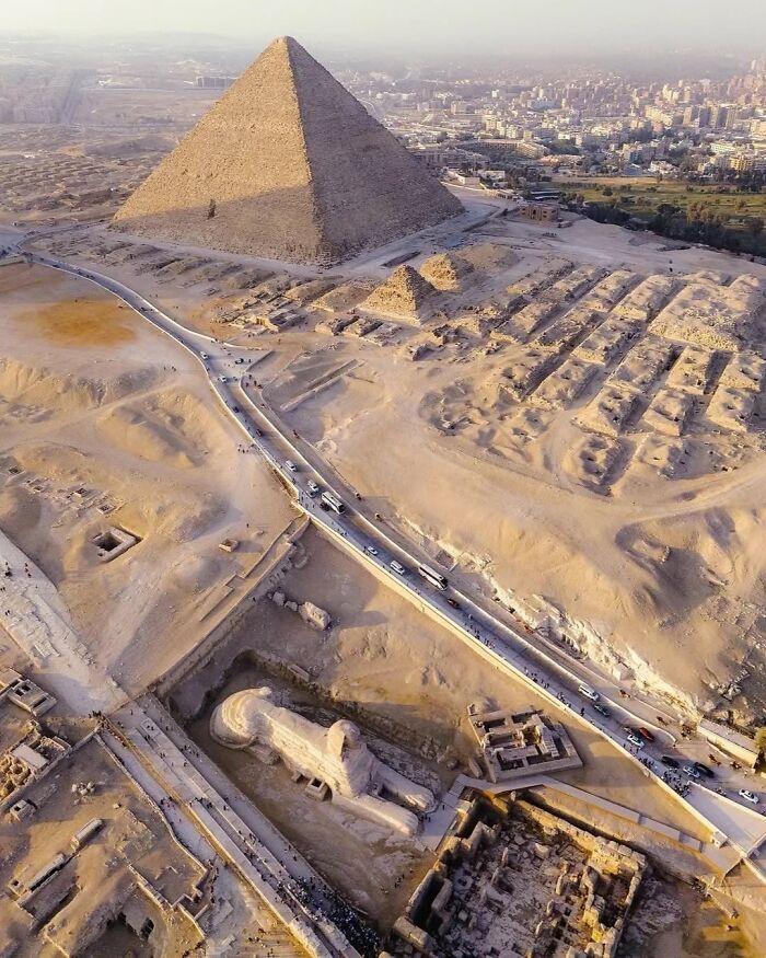 Aerial view of the Great Pyramid and Sphinx at Giza, showcasing incredible photographs from ancient Egypt's historic landmarks.