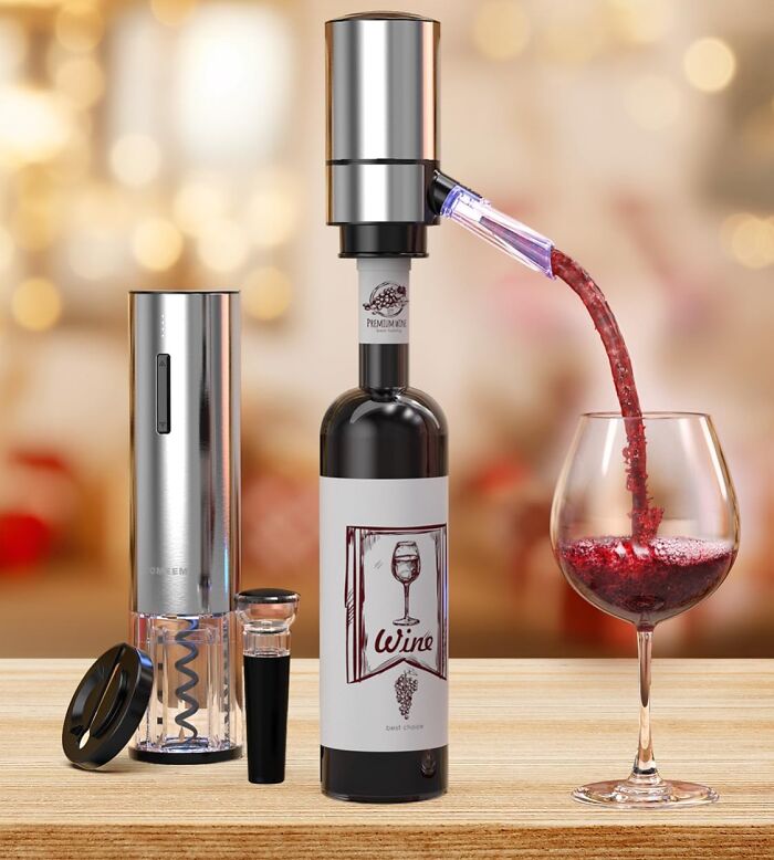 Automatic wine opener and pourer set pouring red wine into a glass, a gift for the teacher with caffeine a*******n.
