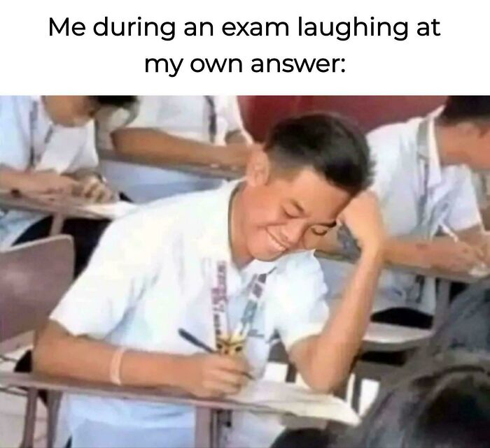 Student laughing at exam answer in classroom, capturing the humor of college memes for students running on hope and energy drinks.