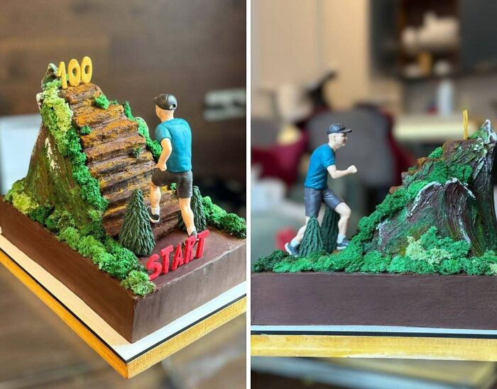 Detailed cake depicting a man climbing steps on a mountain, showcasing masterfully crafted cakes and human creativity.