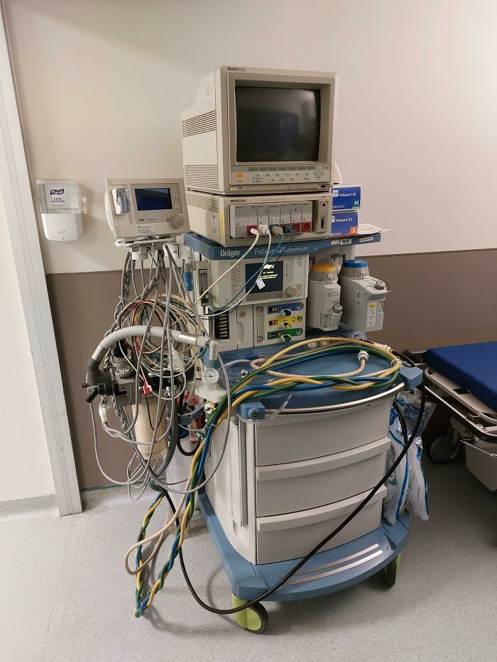 Medical monitoring equipment with various cables and screens in a hospital room, highlighting different jobs making a 9-to-5 bearable.