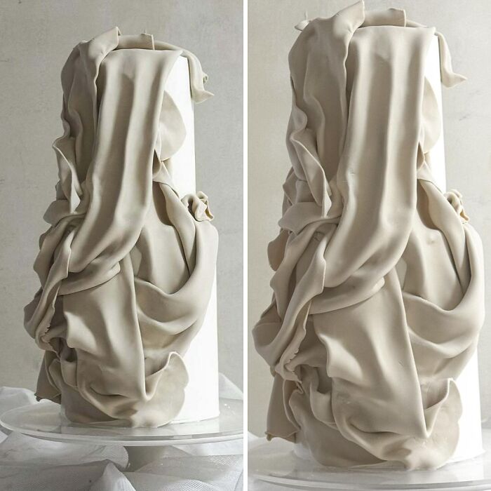 Elegant masterfully crafted cake with intricate flowing fondant design showcasing human creativity and artistic cake decorating skills